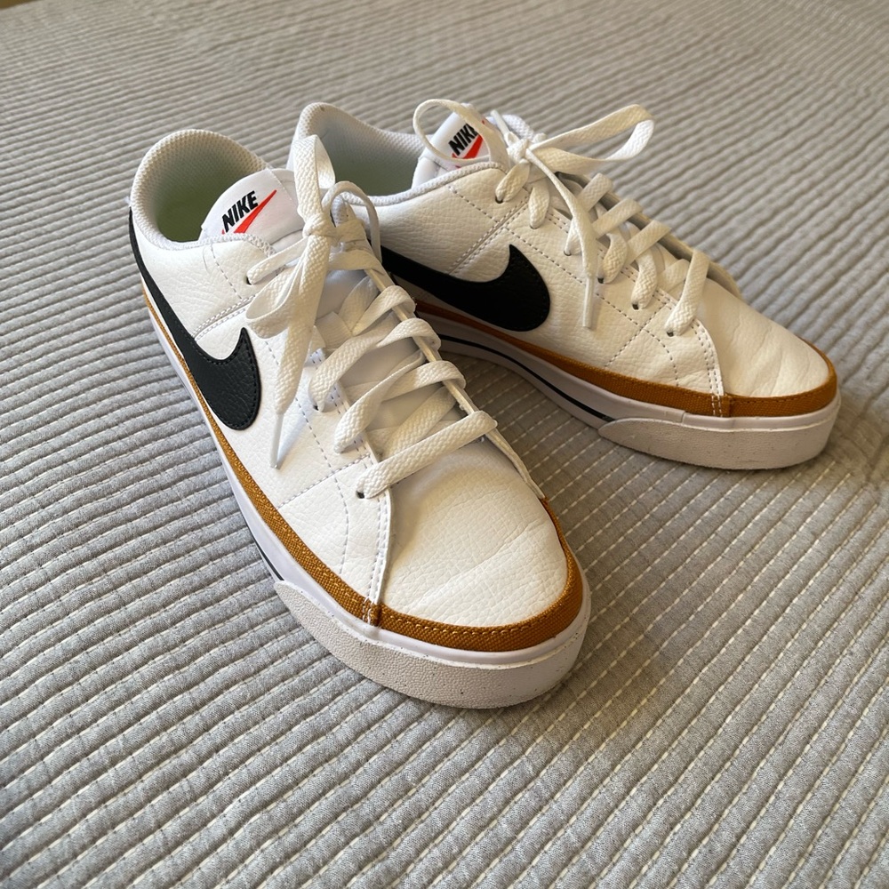 Nike White Sneakers with Black and Gold Details